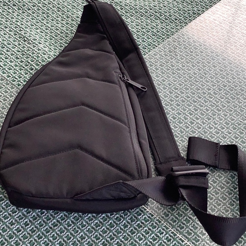 Mini Sling Backpack.  Used but”like new” condition.